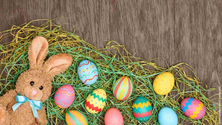 Easter eggs hand painted, rabbit, wood background