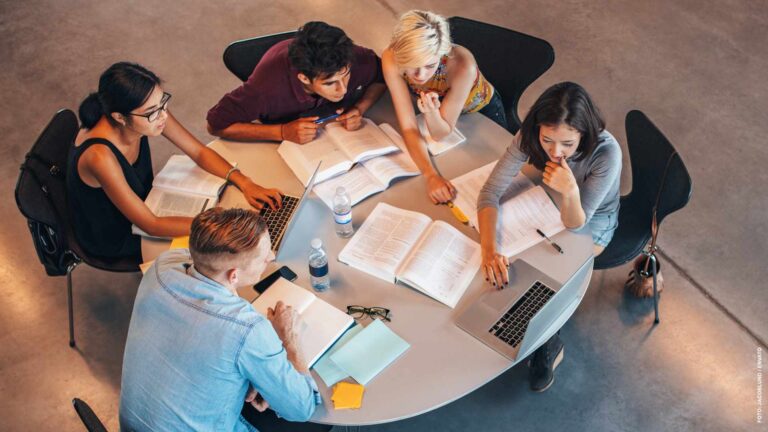 Group of students studying on laptop