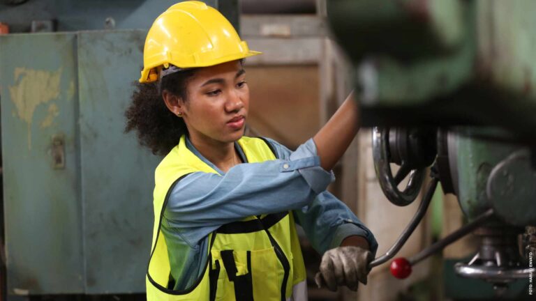 lathe worker working with milling machine in metal industry.