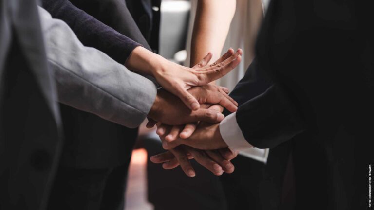 Business people shake hands together, Concept of team unity successful