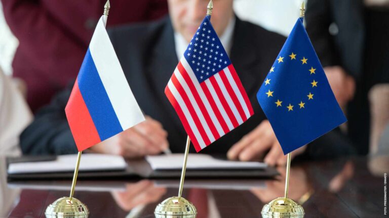 Flags of United States, Russian Federation and European Union against delegate