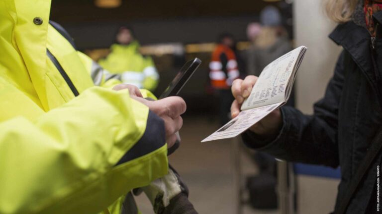 Cropped image of security photographing passport