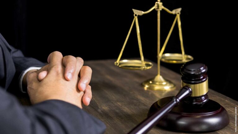 justice and law concept.Male judge in a courtroom working on woo