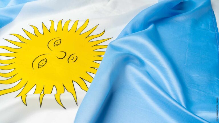 Photo of waving flag of Argentina lying on surface