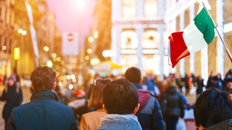 people crowd walking on busy street