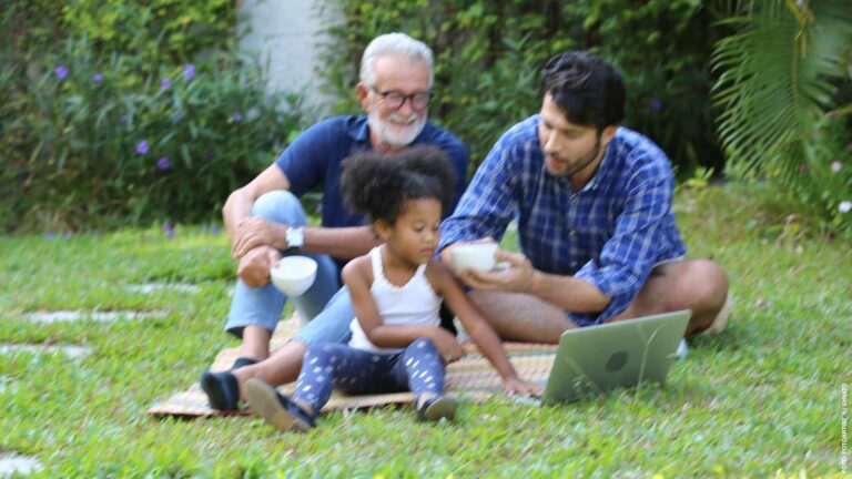 Senior grandparents playing with grandchildren and having fun with family