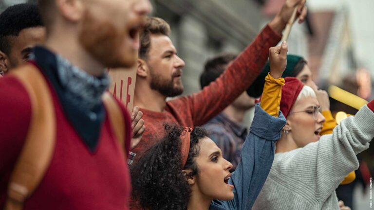 Group of people in rally protesting