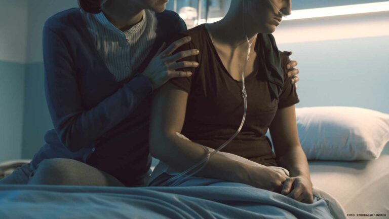 Woman assisting her friend with cancer at the hospital