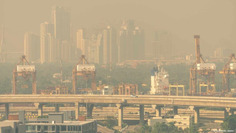 Blur photo of cityscape with polluted air. Air pollution. Smog a