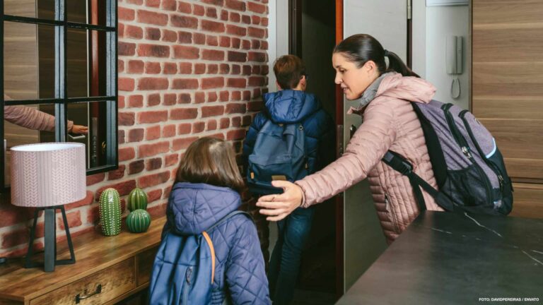 Family with emergency backpacks leaving their front door quickly