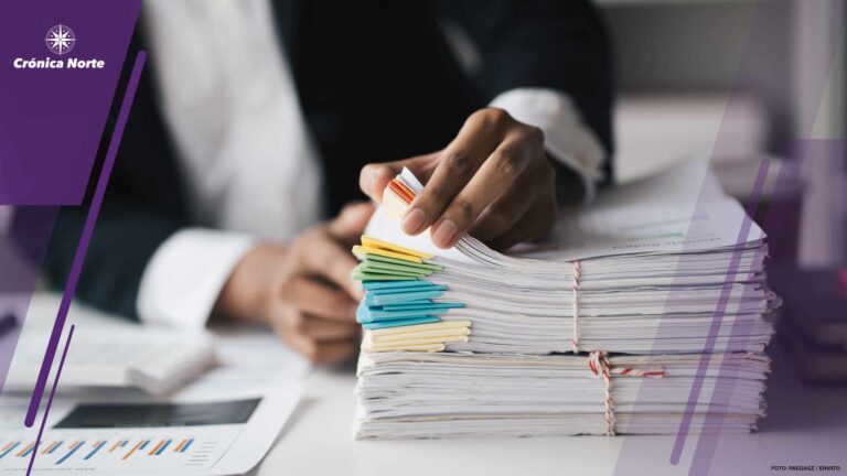 Cropped short of businesswoman working with stack of document, o