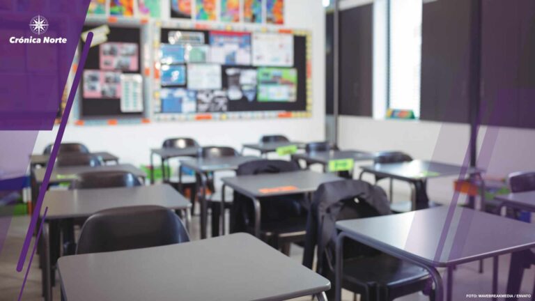 Empty classroom with desks and chairs