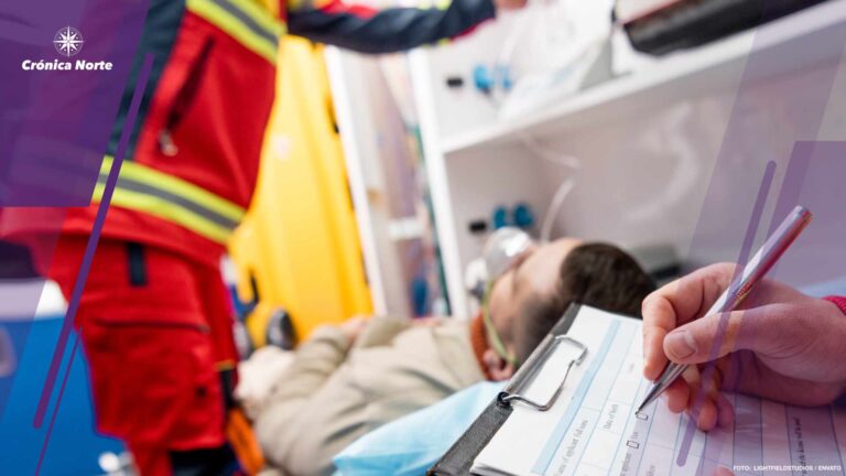 Partial view of paramedic writing diagnosis in clipboard
