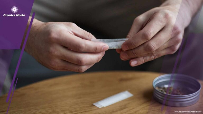 Close up of man rolling cigarette for therapeutic purpose