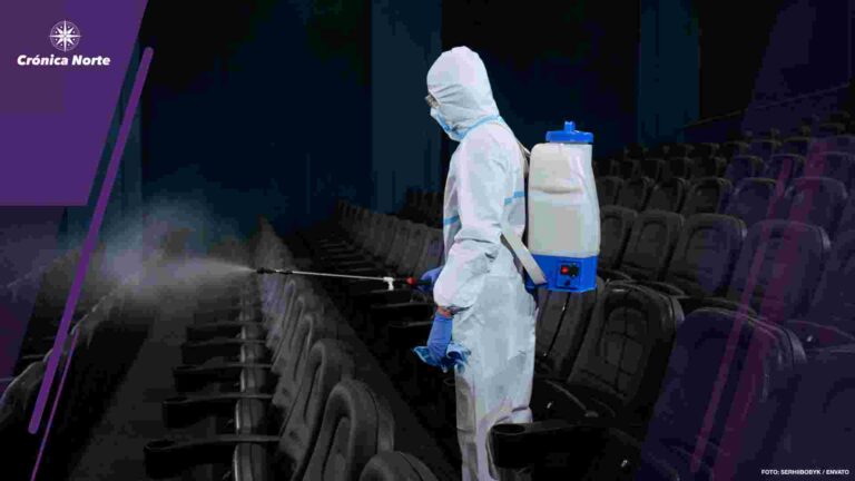 Special person making disinfection in cinema hall.