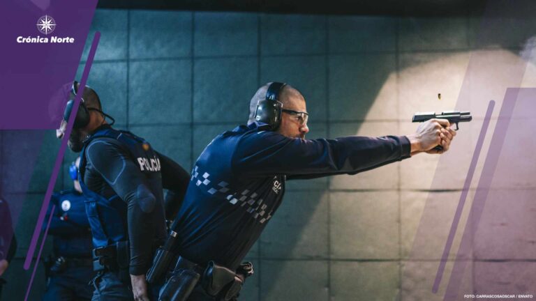 Police training in shooting gallery with short weapon.