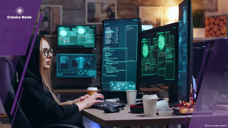 Female hacker wearing a hoodie using a dangerous virus