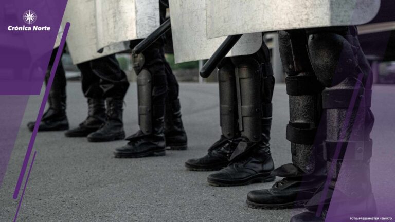 Legs of riot police at street