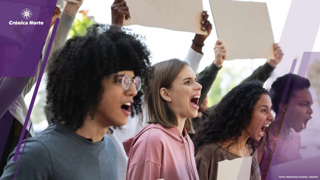 Motivated group of international students making protest outdoors