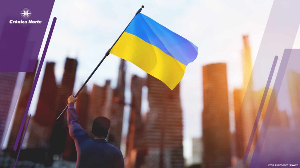 Man with Ukraine flag on city ruin. Ukrainian victory