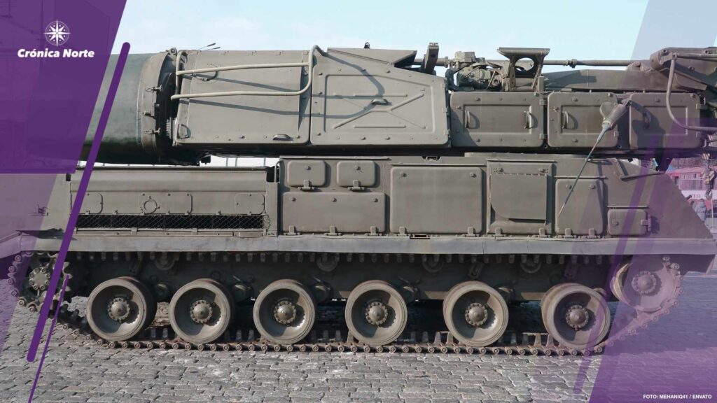 Close up of green armoured caterpillar transport. Modern military transportation vehicle technologies