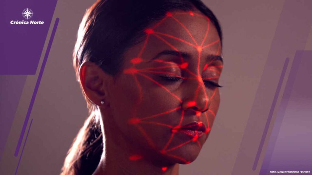 Facial Recognition Technology Concept As Woman Has Red Grid Projected Onto Face In Studio