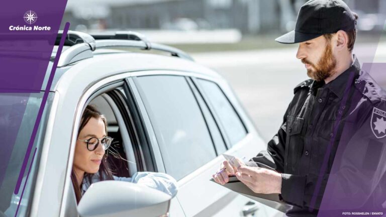 Policeman with woman driver on the road