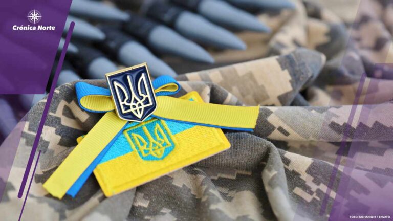 Ukrainian symbol and a machine gun belt on the camouflage uniform of a Ukrainian soldier. The Concept of war in Ukraine, patriotism and protecting your country from occupiers
