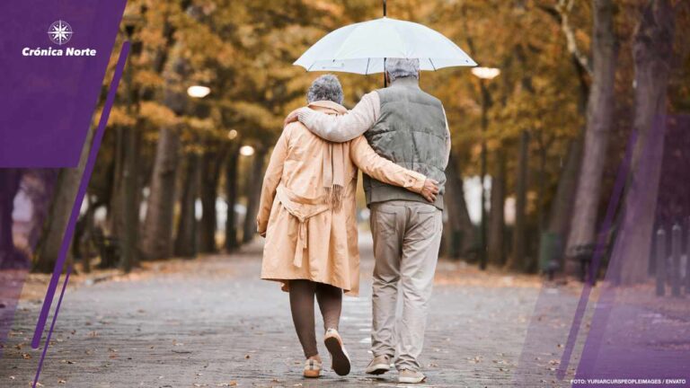 Elderly, couple walk in park with umbrella and fresh air, outdoo
