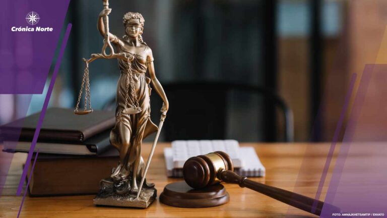 Statue of lady justice on desk of a judge or lawyer.